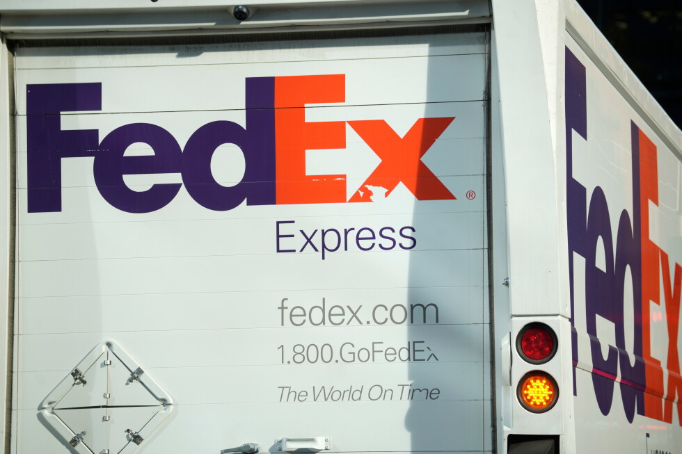 The company logo is shown on a FedEx delivery van, Sept. 13, 2023, in downtown Denver. (AP Photo/David Zalubowski, File)