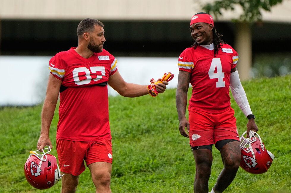 Kansas City Chiefs tight end Travis Kelce (87), and wide receiver Rashee Rice (4) walk to NFL football training camp Friday